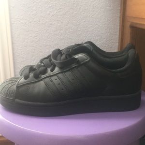 All black adidas all-stars